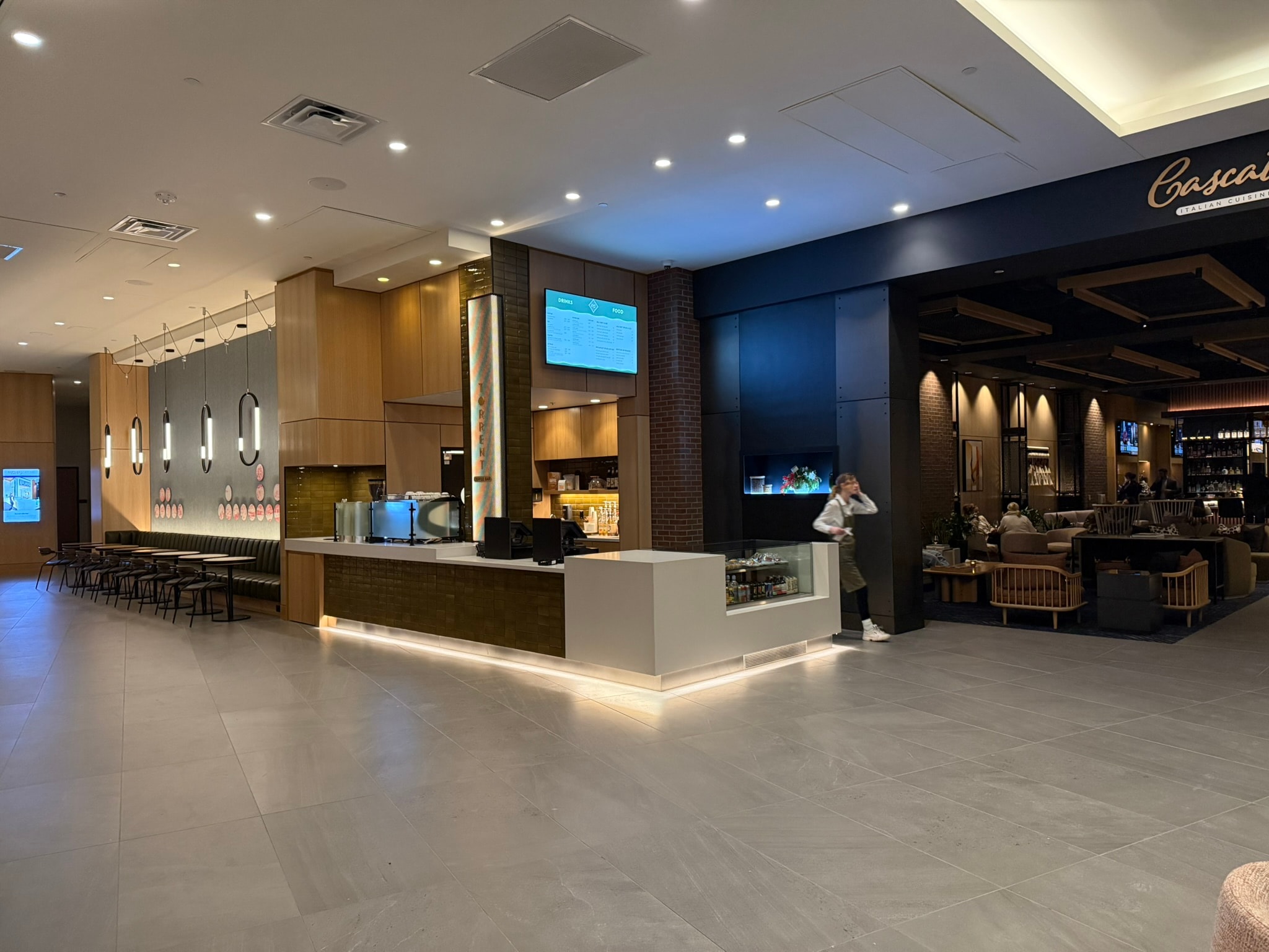 Cascata Italian restaurant entrance with dark ceiling and open dining room