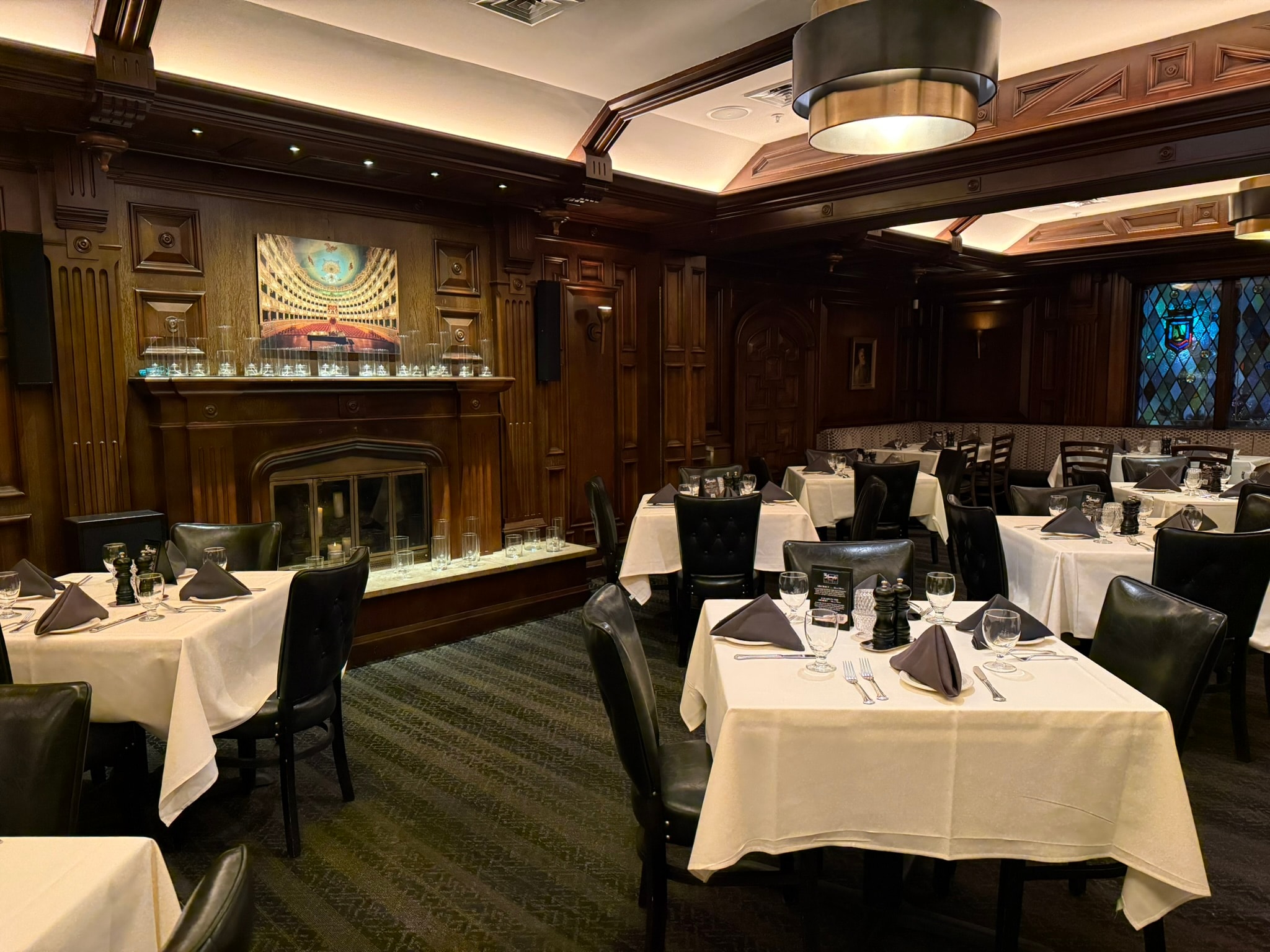 The Lexington staircase and piano lounge with stained glass windows