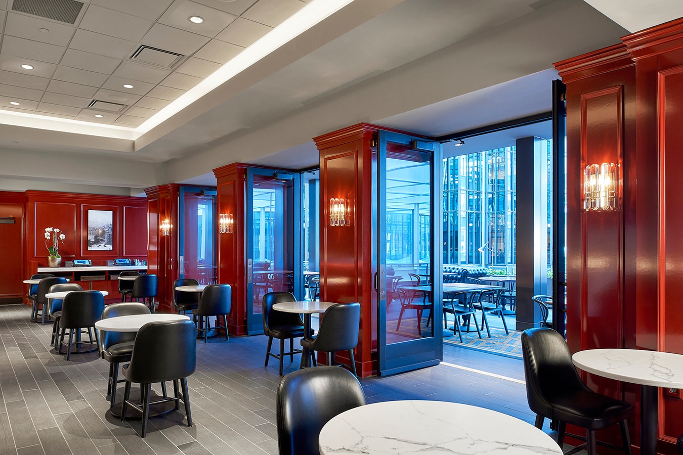 Marquette Hotel - red lacquered dining room with folding glass doors to atrium
