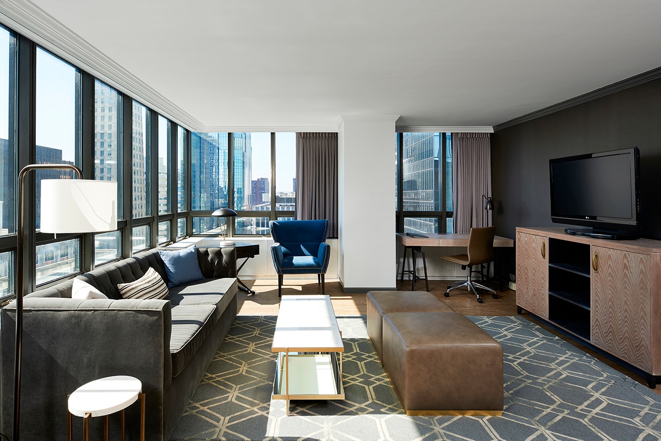 Marquette Hotel - suite living area with city skyline views