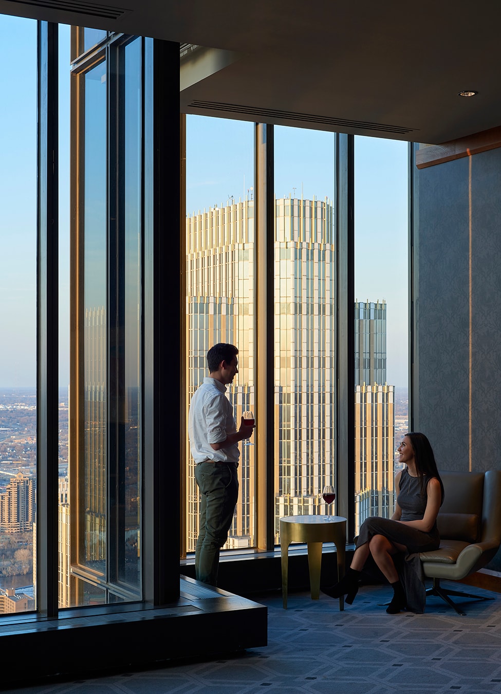 Marquette Hotel - couple enjoying drinks with panoramic city views
