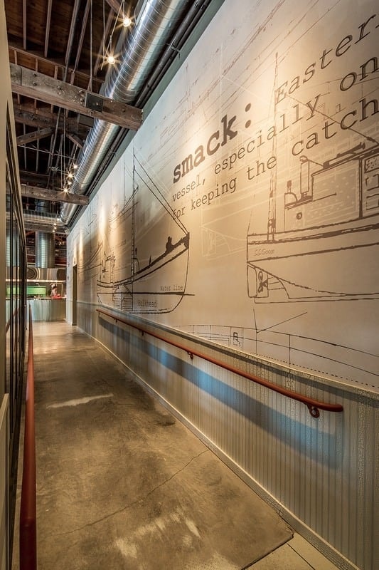 Smack Shack MPLS - long bar with exposed brick, timber ceiling, and full back bar