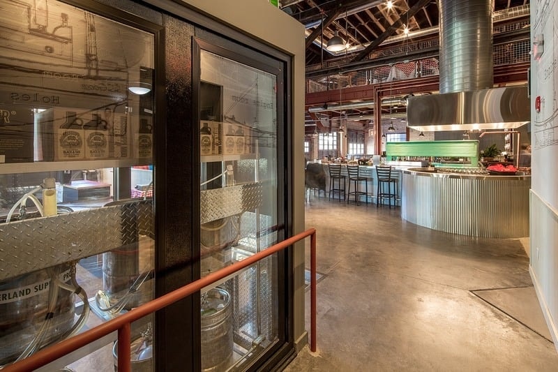 Smack Shack MPLS - dining room with red mezzanine, checkered tablecloths, and open kitchen